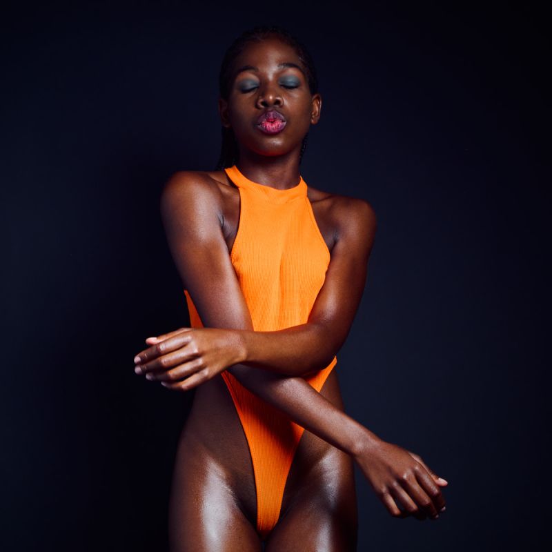 Lucia Bindang in Orange Black by Kenneth Svendlund